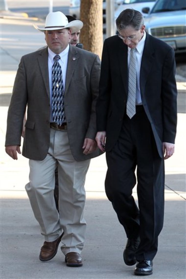 Warren Jeffs is escorted by security into the Tom Green County Courthouse, on Tuesday, in San Angelo, Texas. Jeffs faces two counts of sexual assault of a child.